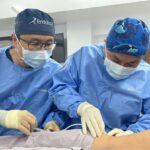 Vascular surgeons performing endovascular aneurysm repair procedure